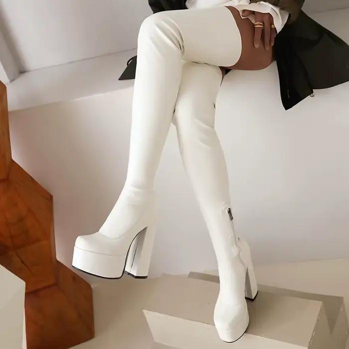 Bottes au genou en matériau PU élastique à talon épais et creux Ultra-haut